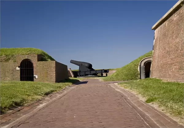 USA, MD, Baltimore. Large cannons aim out towards the harbor around Fort McHenry