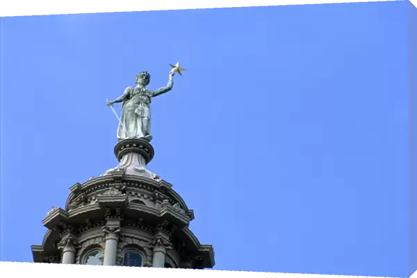 The Goddess of Liberty on top of the Texas state capitol building in Austin
