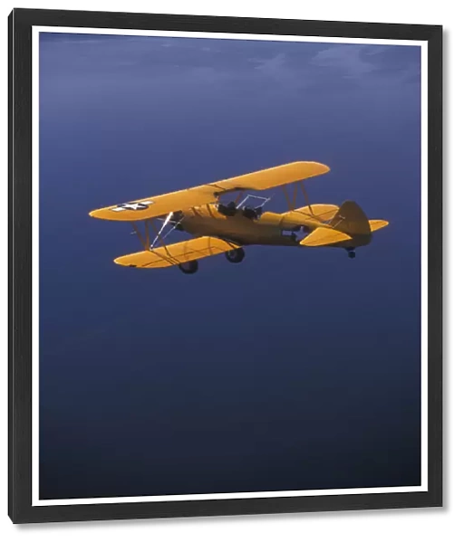 P. R. Yellow Biplane, 1944 Stearman PT-17, flying over Puget Sound, WA