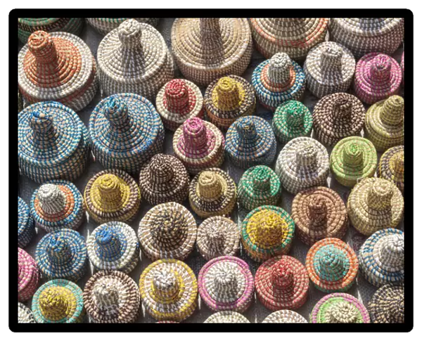 West Africa, The Gambia, Banjul. A collection of colorful woven baskets viewed from above