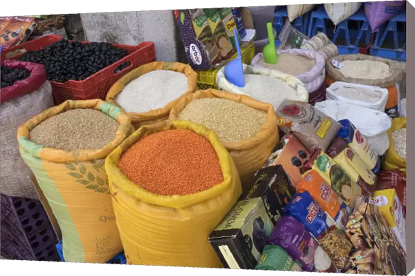Morocco, Casablanca. Bags of lentils, rice and other dry goods at a shop in the medina