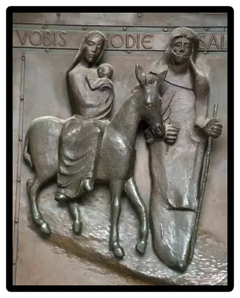Bronze relief of Mary, Joseph and infant Jesus traveling to Egypt to escape wrath