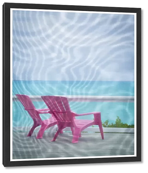 Bahamas, Little Exuma Island. Deck chairs seen through screen door