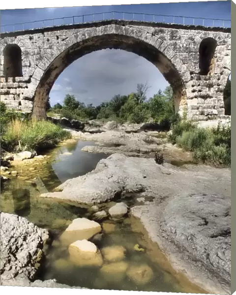 This is a Roman bridge, called Pont Julien near the town of Lacoste