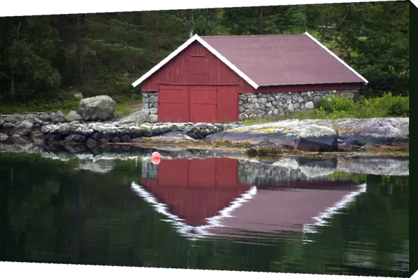 Europe, Norway, Stavanger. Boathouse and reflection on Lysefjord