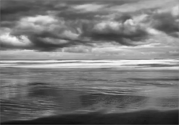 USA, Oregon, Cannon Beach, Storm clouds roil over the Pacific Ocean