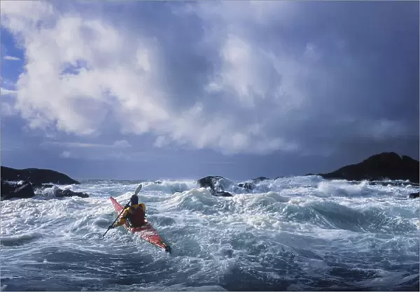 USA, Alaska. Male sea kayaker in 17 ft confused storm seas off Chichagof Island in SE Alaska