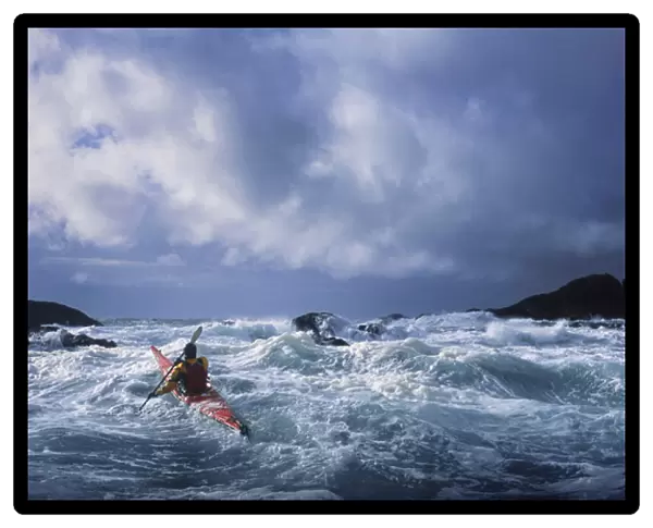 USA, Alaska. Male sea kayaker in 17 ft confused storm seas off Chichagof Island in SE Alaska