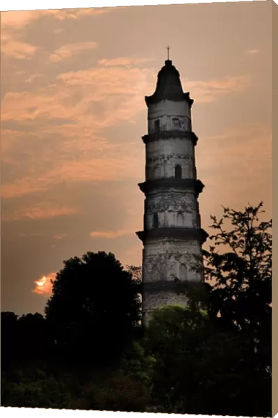 Great Mercy Pagoda, Shaoxing, Zhejiang Province, China, Sunrise in orange pink sky