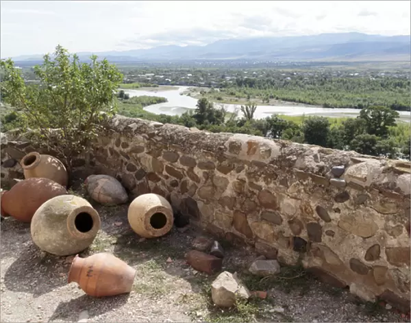 Georgia, Uplistsikhe. Scattered pots and a view of the Mtkvari river