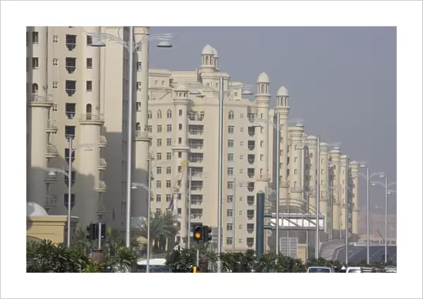 United Arab Emirates, Dubai. Apartment buildings next to main road in the Palm Jumeirah