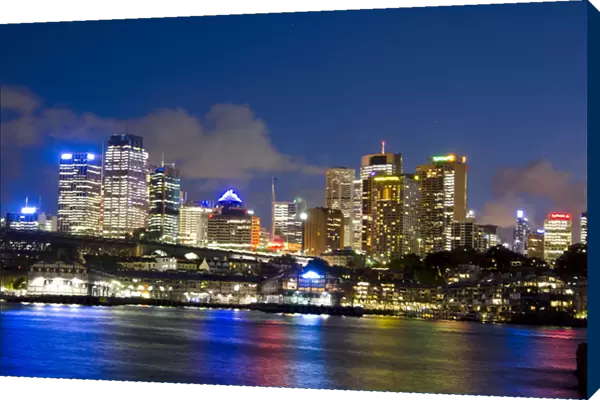 Colorful twilight night shot of colorful skyline of offices in Sydney Australia New