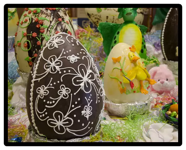 Australia. Easter display of ornately decorated large dark chocolate eggs and candy