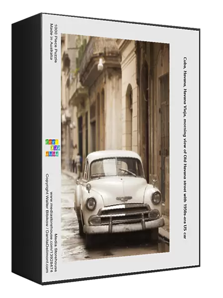 Cuba, Havana, Havana Vieja, morning view of Old Havana street with 1950s-era US car