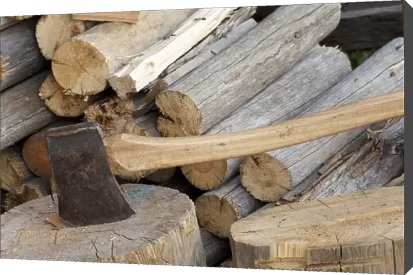 Canada, British Columbia, Fort Steele. Close-up of axe and woodpile