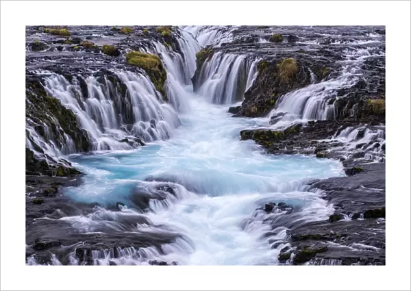 Iceland, Bruarfoss. Waterfalls flow into river