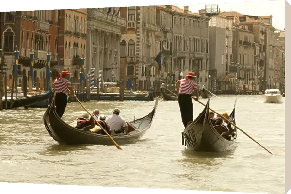 Italy; Venice. Tourist ride in gondolas on the Grand Canal in Venice