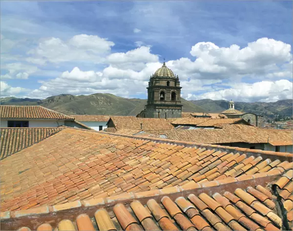 Cusco, Peru, red tiled rooftops and the Cusco Cathedral and mountains