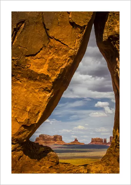 View through the Teardrop Arch into Monument Valley Tribal Park of the Navajo Nation