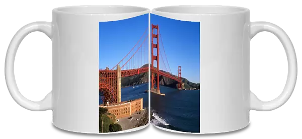 Morning light bathes the Golden Gate Bridge & Fort Point