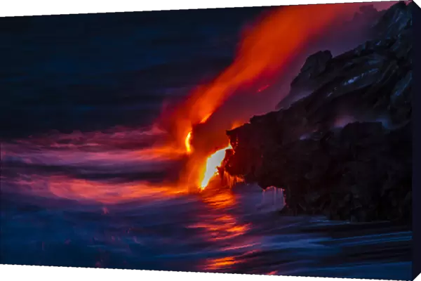 USA, Hawaii, The Big Island, Kilauea. Molten lava flowing into ocean at night. Credit as