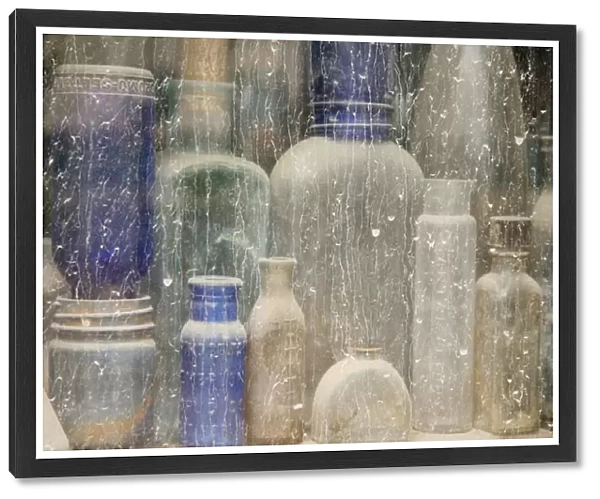 USA, Idaho, Idaho City. Close-up of dusty bottles in window
