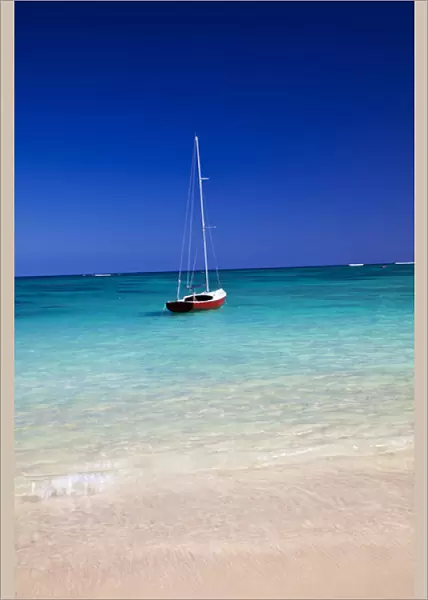 USA; Hawaii; Oahu; Sail Boat at Anchor in Blue Water With Swimmer