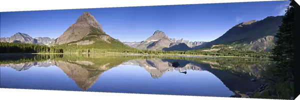Mountains reflected in Lake. Glacier National Park. Montana. USA