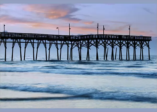 USA, North Carolina. Sunrise at Sunset Beach pier