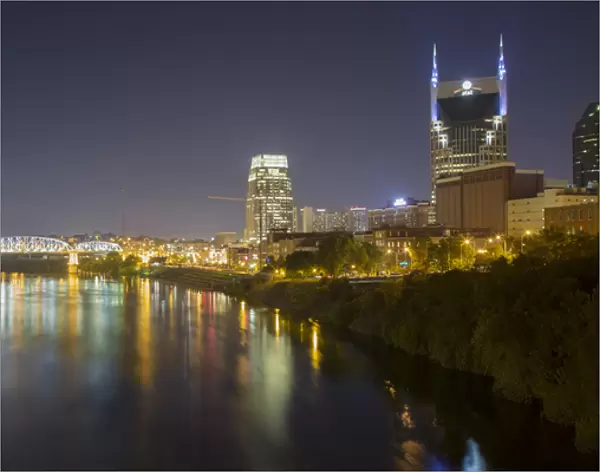 USA, Tennessee, Nashville. City lights reflected in Cumberland River