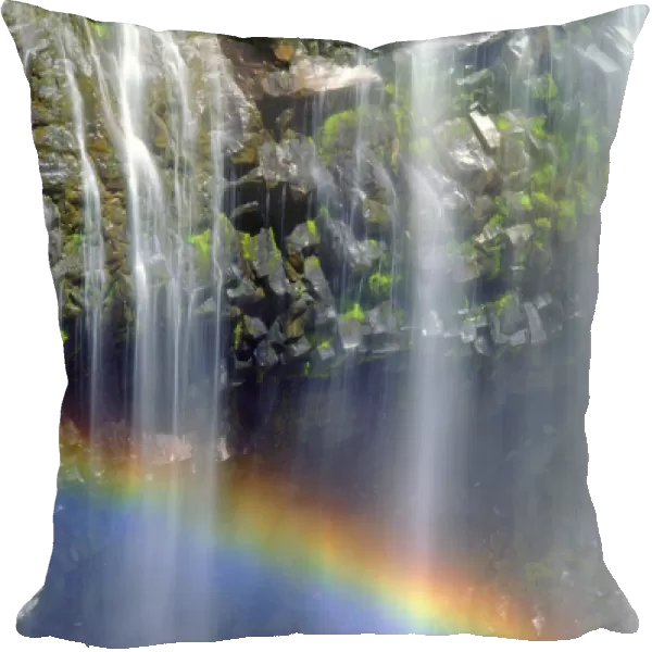 USA; Washington; Mount Rainer National Park; Rainbow at the base of a waterfall