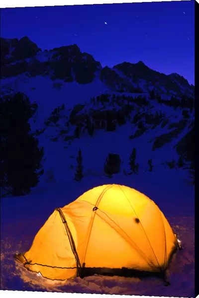 Yellow dome tent at night in winter, John Muir Wilderness, Sierra Nevada Mountains