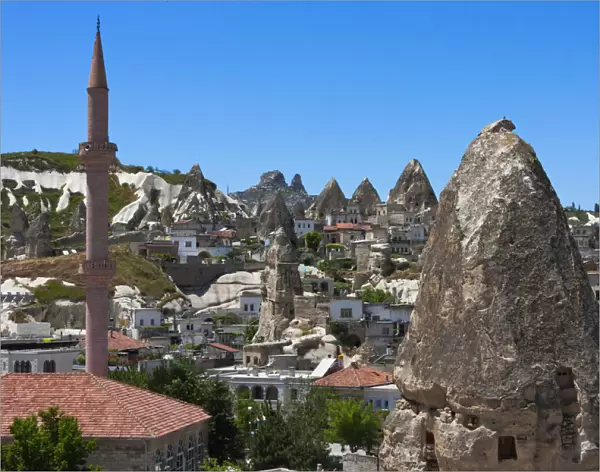 Houses and churches carved into rock formation, Goreme, Cappadocia, Turkey