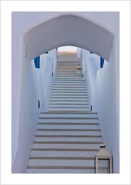 White house on the coast of Aegean Sea. Oia, Santorini Island, Greece