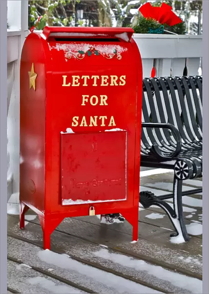 Fresh snow on red mailbox for letters to Santa, town of Snoqualmie