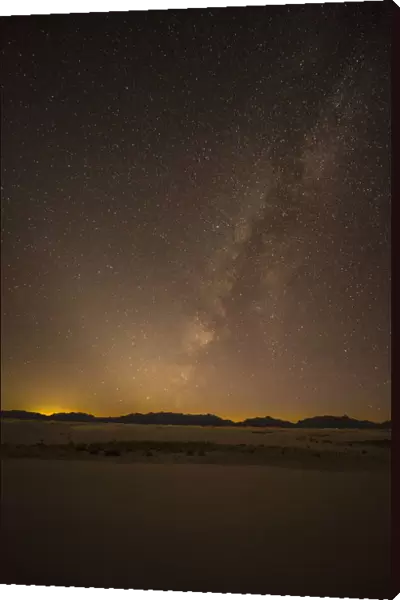 USA, New Mexico, White Sands National Park. Desert and Milky Way at night. Credit as