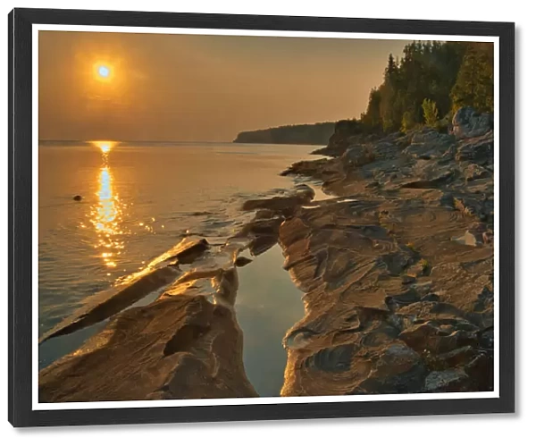 Canada, Ontario, Bruce Peninsula National Park. Sunset on limestone rock