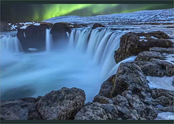 Iceland. Aurora borealis and the Godafoss Waterfall