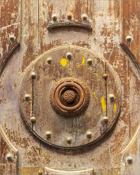 Italy, Sicily, Palermo Province, Cefalu. Detail of an exterior wooden door on the Cefalu