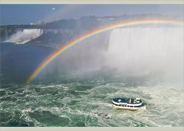 Canada, Ontario, Niagara Falls. Maid of the Mist tour boat and rainbow