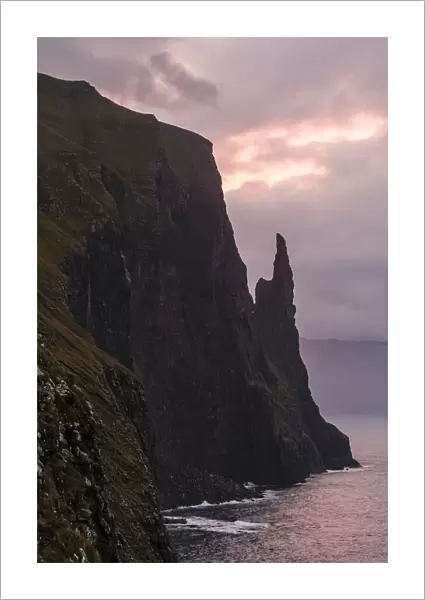 Europe, Faroe Islands. Morning view of Trollkonufingur, also known ass Witchs Finger