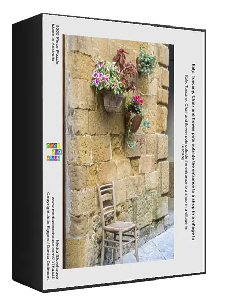Italy, Tuscany. Chair and flower pots outside the entrance to a shop in a village in