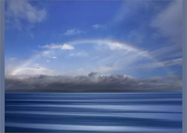 USA, Washington State, Seabeck. Composite of rainbow over Hood Canal