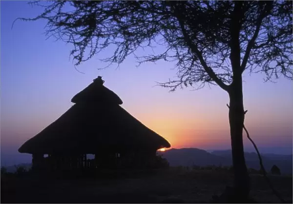 Africa, Ethiopia, Omo river region, Sunset over a traditional Konso hut