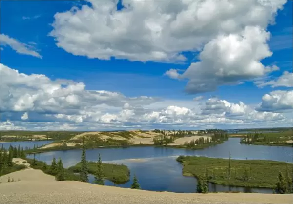 Cumulus clouds float above lakes, Northwest Territories, Canada