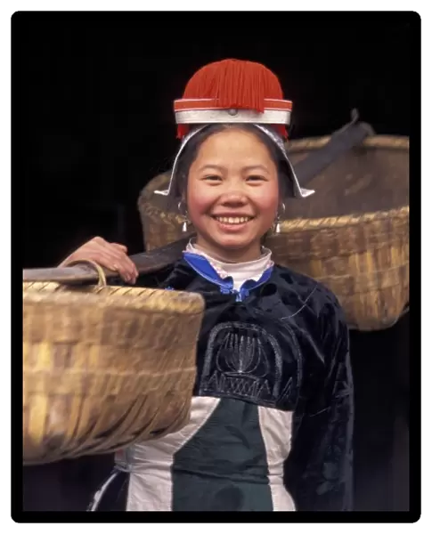 Gejia Miao girl carrying baskets in traditional costume, Matang, Guizhou Province, China