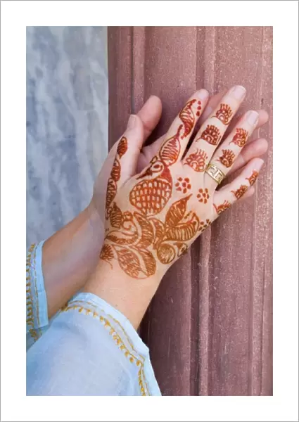 Colorful Henna design on womans hands artwork for celebration tatoos in Delhi India (MR)