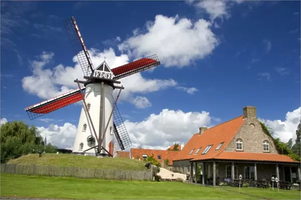 A windmill and old stone restaurant in the town of Ramskapelle in the municipality