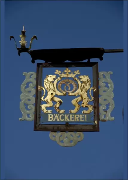Germany, Franconia, Rothenburg. Traditional hanging sign with gold lions