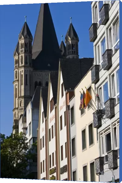 Germany, Nordrhein-Westfalen, Cologne. Rhein riverside buildings and Gross St. Martin Church